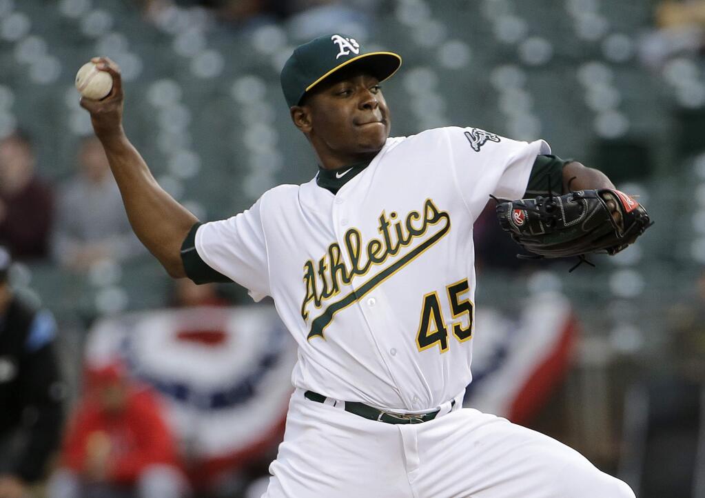 Oakland Athletics pitcher Jharel Cotton (45) throws against the Los Angeles Angels during the first inning of a baseball game in Oakland, Calif., Wednesday, April 5, 2017. (AP Photo/Jeff Chiu)