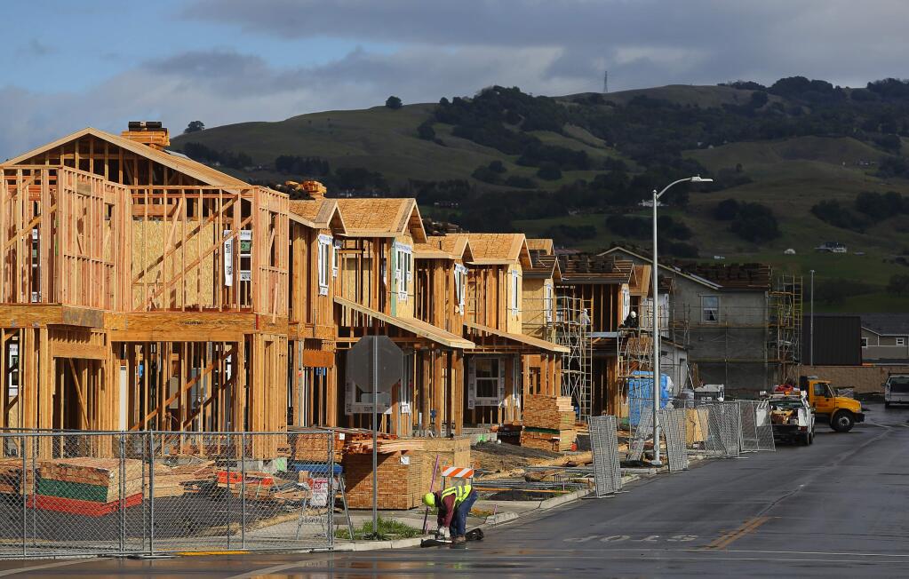 A row of new homes under construction in the University District development in Rohnert Park on Thursday, February 22, 2018. (Christopher Chung/ The Press Democrat)