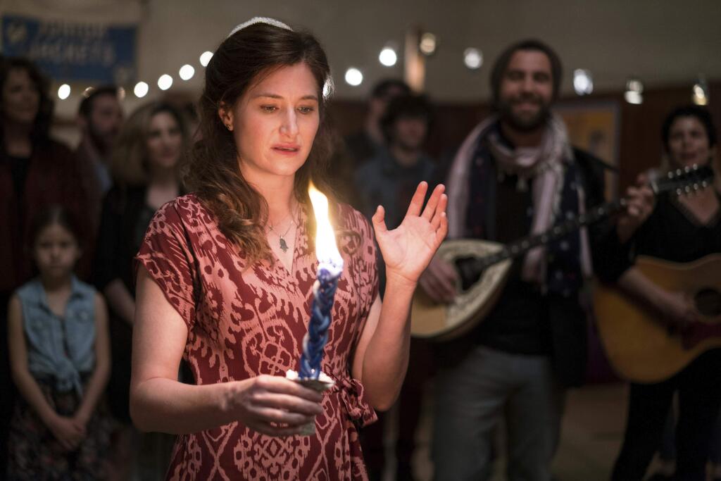 This image released by Amazon shows Kathryn Hahn in 'Transparent.' Hahn was nominated for an Emmy Award for outstanding supporting actress in a comedy series on Thursday, July 13, 2017. The Emmy Awards ceremony, airing Sept. 17 on CBS, will be hosted by Stephen Colbert.(Jennifer Clasen/Amazon via AP)