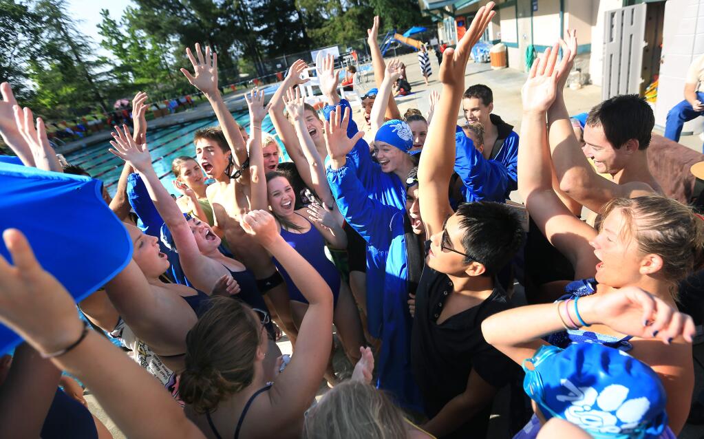 The Analy High School swim team participates in a team cheer during a dual meet against Healdsburg, Thursday April 23, 2015 in Healdsburg. (Kent Porter / Press Democrat)