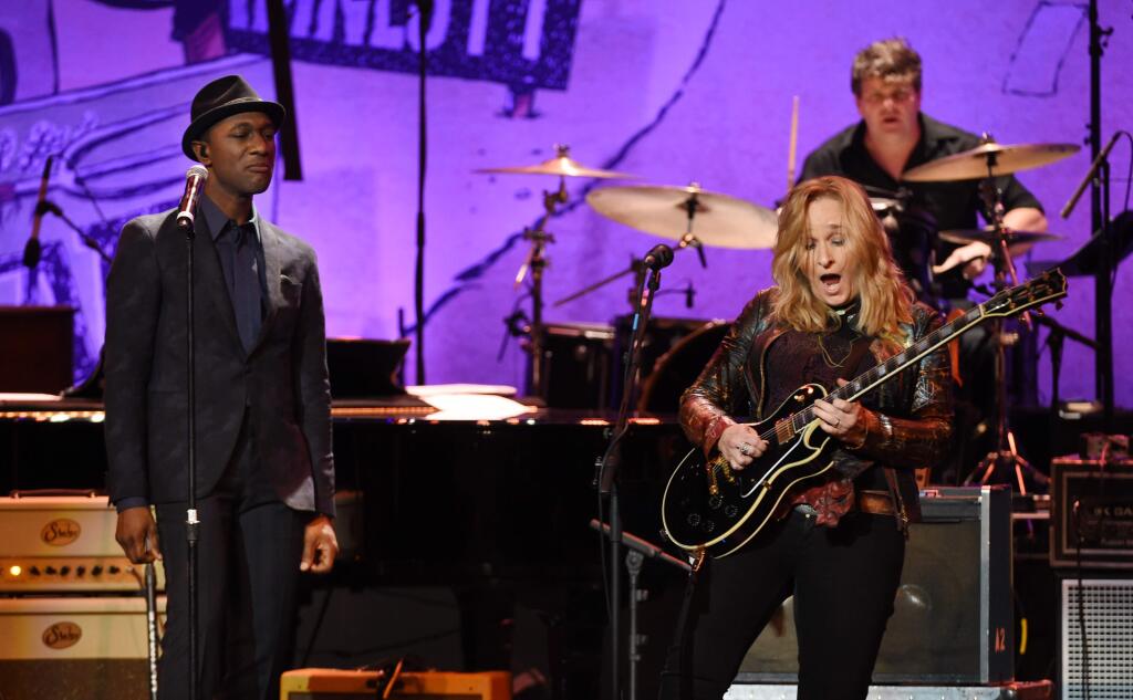Aloe Blacc, left, and Melissa Etheridge perform together at the 17th Annual GRAMMY Foundation Legacy Concert at the Wilshire Ebell Theatre on Thursday, Feb. 5, 2015, in Los Angeles. (Photo by Chris Pizzello/Invision/AP)
