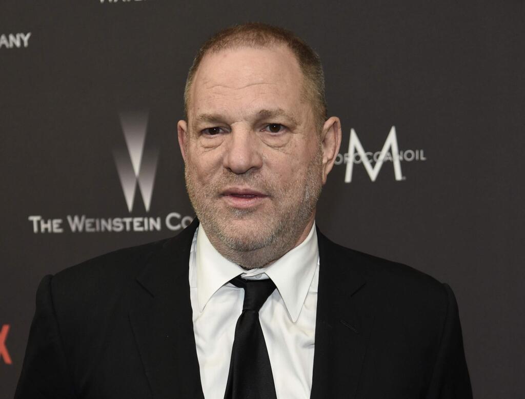 FILE - In this Jan. 8, 2017, file photo, Harvey Weinstein arrives at The Weinstein Company and Netflix Golden Globes afterparty in Beverly Hills, Calif. A former personal assistant for Harvey Weinstein alleges she was forced to undertake such tasks as cleaning up after his sexual encounters and taking dictation from him while he was naked. (Photo by Chris Pizzello/Invision/AP, File)