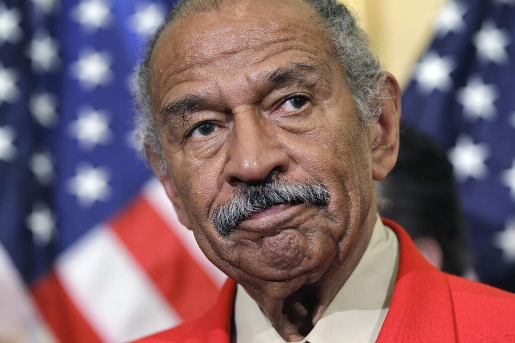File - In this April 4, 2011 file photo, Rep. John Conyers, D-Mich., the ranking member of the House Judiciary Committee, listens during a news conference on Capitol Hill in Washington. Top House Democrat Nancy Pelosi says Conyers, facing sexual misconduct allegations, should resign. (AP Photo/J. Scott Applewhite)