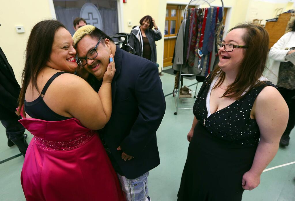 After picking out their jackets and prom dresses Angel Huerta, left, and Michael Lopez practice dancing to the delight of Alheli Carles. Over 100 special needs students will attend the 'A Night of the Red Carpet' prom at the Mayacama Golf Club on March 5, 2016. (JOHN BURGESS / The Press Democrat)