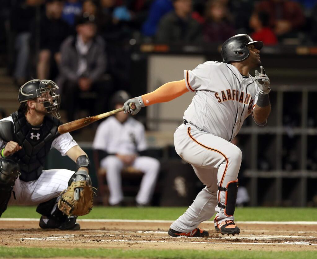 San Francisco Giants third baseman Pablo Sandoval, right, watches his flyout to the left field with Chicago White Sox catcher Kevan Smith during the second inning in Chicago, Friday, Sept. 8, 2017. (AP Photo/Jeff Haynes)