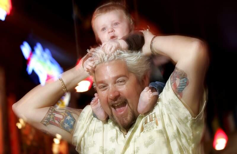 Guy Fieri, with his 5-month-old son Ryder, recently returned from New York, where he was taping his show for the Food Network. Photo taken May 25, 2006.(The Press Democrat/ Christopher Chung)
