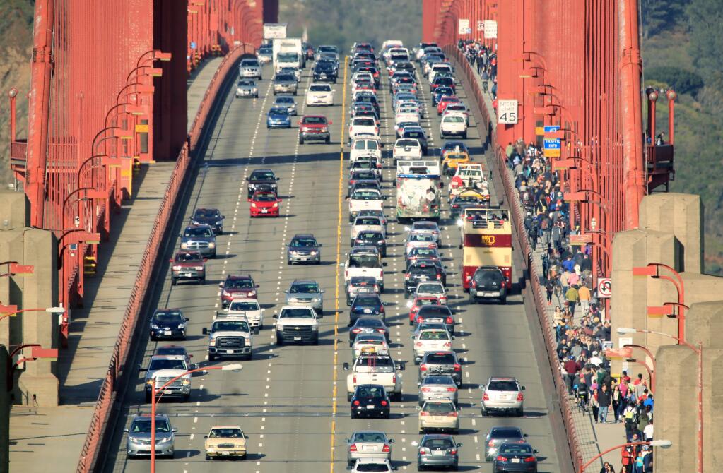 Motorists, pedestrians, and cyclists traverse the Golden Gate Bridge on Monday, October 27, 2014 near San Francisco, California . (BETH SCHLANKER/ The Press Democrat)