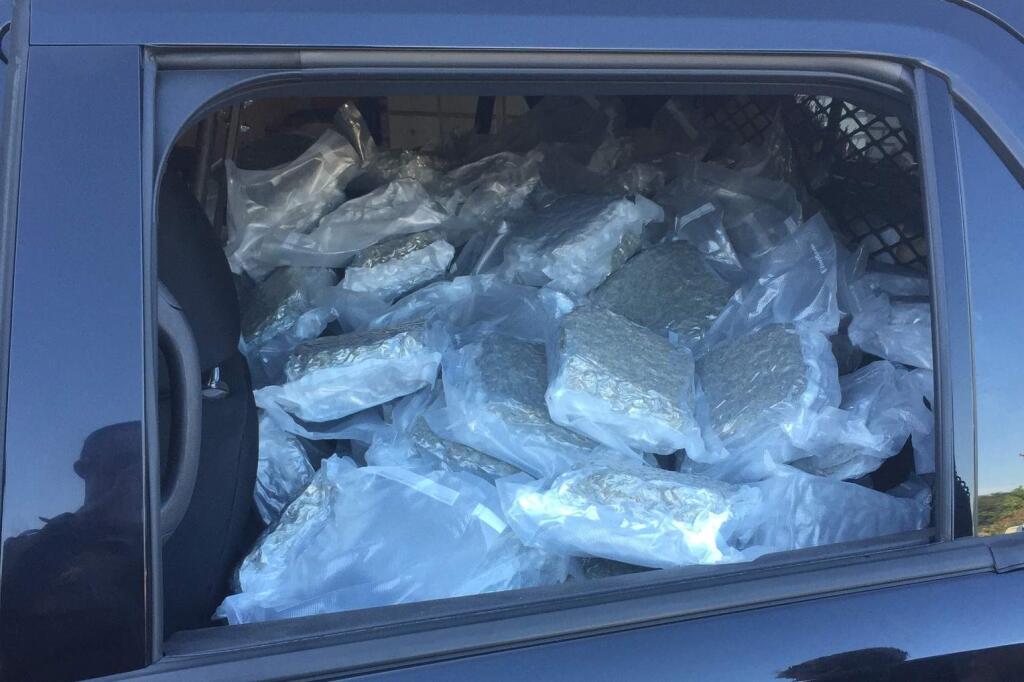 The 225 pounds of pot found during the search of an Oakland mans car after a traffic stop on Highway 101 in Cloverdale is show in the back of a CHP cruiser on Tuesday, Aug. 26, 2015. (COURTESY OF CHP)