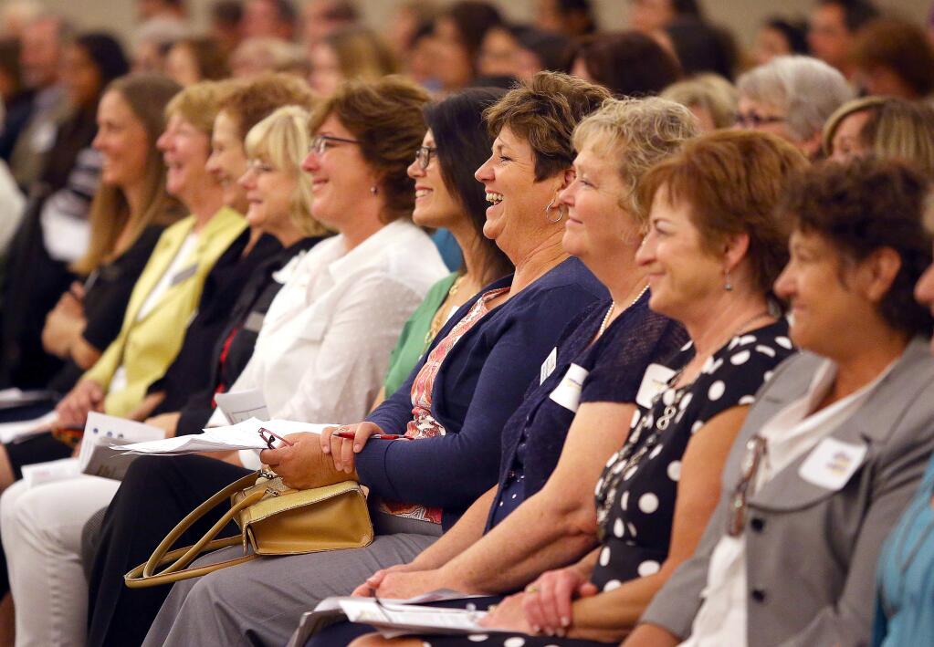 The audience laughs at a remark made by Mona Babauta, executive director of Solano County Transit, during the 'When Women Succeed, America Succeeds' forum at Sonoma State University, in Rohnert Park on Thursday, August 14, 2014. (Christopher Chung/ The Press Democrat)