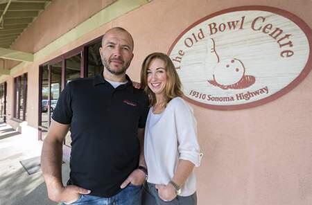 Adam and Jenny Kovacs in front of the Olde Bowl Center.
