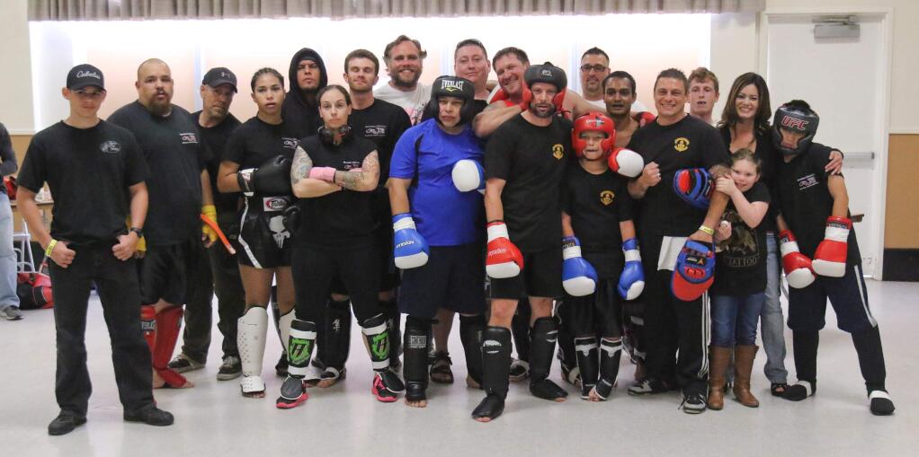Mixed martial arts athletes pose before their matches at the Throw Down in Ptown boxing and ring sports event at the Veteran's building in Petaluma on Saturday, April 25, 2015. (SCOTT MANCHESTER/ARGUS-COURIER STAFF)