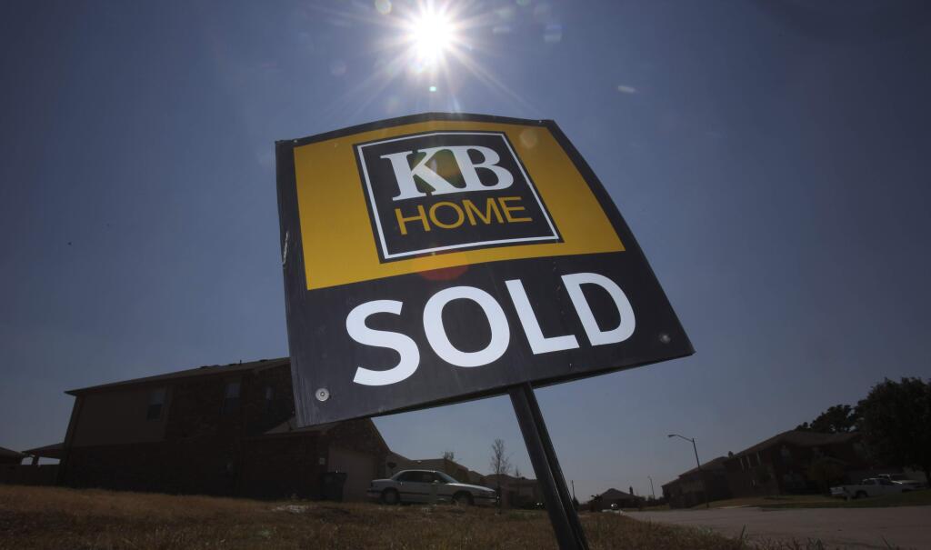 FILE - This Sept. 21, 2011, file photo, shows a KB Home sign in a vacant lot in Balch Spring, Texas. On Thursday, Sept. 21, 2017, KB Home issued an apology on behalf of their chief executive. KB Home has put CEO Jeffrey Mezger on notice following his vulgar rant against comedian Kathy Griffin. The homebuilder said if a similar incident occurs, Mezger will be let go from his post. The company is also cutting his bonus for the current year by 25 percent. (AP Photo/LM Otero, File)