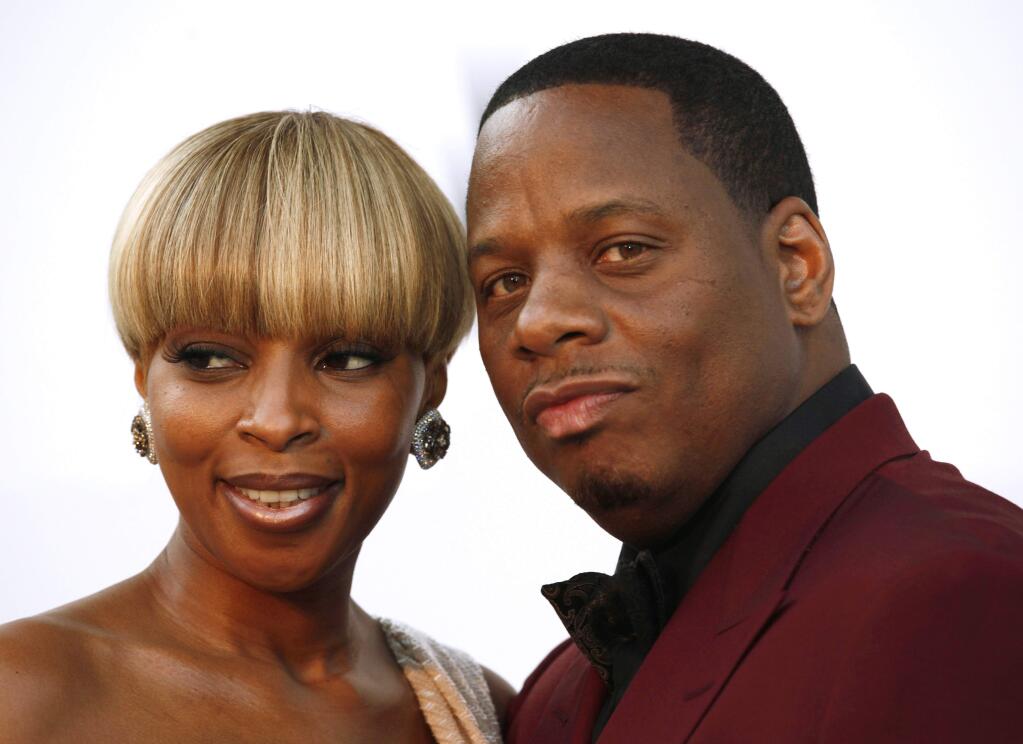 FILE - In this May 20, 2010 file photo, singer Mary J. Blige and her husband, Martin Kendu Isaacs, arrive for the amfAR Cinema Against AIDS benefit during the 63rd Cannes international film festival, in Cap d'Antibes, southern France. Blige is ending her marriage to her husband-manager after nearly 13 years. Court records show the singer filed for divorce from Isaacs on Tuesday, July 26, 2016, is Los Angeles, citing irreconcilable differences. (AP Photo/Matt Sayles, File)