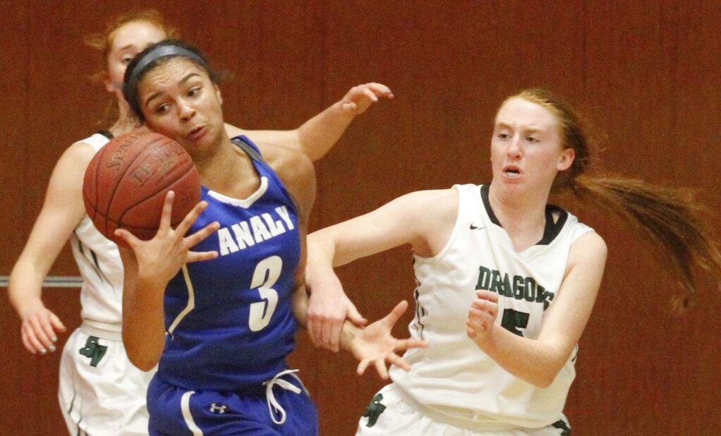 Bill Hoban/Index-TribuneSonoma's Kayla field, right, and Amy Stanfield, back, try to trap Analy's Bailey Hunter during the Sonoma County League tournament championship game Saturday, Feb. 18. Analy beat the Lady Dragons 45-35.