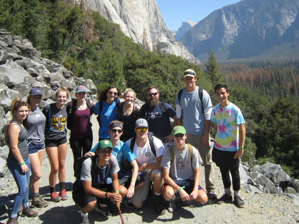 Three of the students on the Justin Yosemite trip pictured on a hike: Erica Carmona and Talia Rizzo ( fifth and sixth from left in back row ); and Ben Myasaki (back row far right)