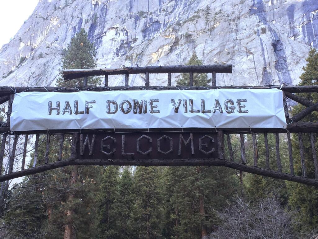 FILE - In a Tuesday, March 1, 2016 file photo, a sign that used to welcome visitors to Curry Village now reads Half Dome Village, in Yosemite National Park, Calif. (Rory Appleton/The Fresno Bee via AP, File)