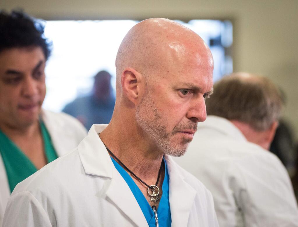 Dr. Marc Levy, an Orlando Health trauma surgeon, is seen at a press conference where he and eight other surgeons who were among the first to respond to the mass shooting at Pulse nightclub spoke about the experience, at the Orlando Regional Medical Center in Orlando, Fla., on Tuesday, June 14, 2016. (Loren Elliott/Tampa Bay Times via AP)