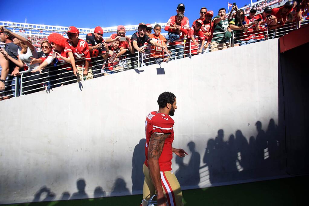 Colin Kaepernick walks to the locker room after the Niners loss to the Packers 17-3 at Levi Stadium in Santa Clara, Sunday Oct. 4, 2015. (Kent Porter / Press Democrat) 2015