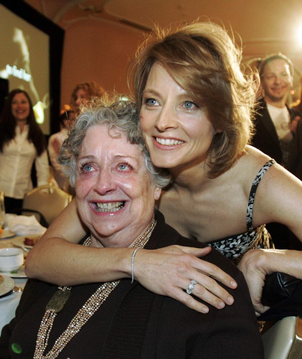 FILE - This Dec. 4, 2007 file photo shows actress-director Jodie Foster, right, with her mother Evelyn Foster after she received the Sherry Lansing Leadership Award at during the 16th annual Women in Entertainment breakfast in Beverly Hills, Calif. Evelyn “Brandy” Foster, who managed her daughter Jodie's career from her child-prodigy years through two Academy Awards, died peacefully at her Los Angeles home of complications from dementia, Monday, May 13, 2019. She was 90. (AP Photo/Kevork Djansezian, File)