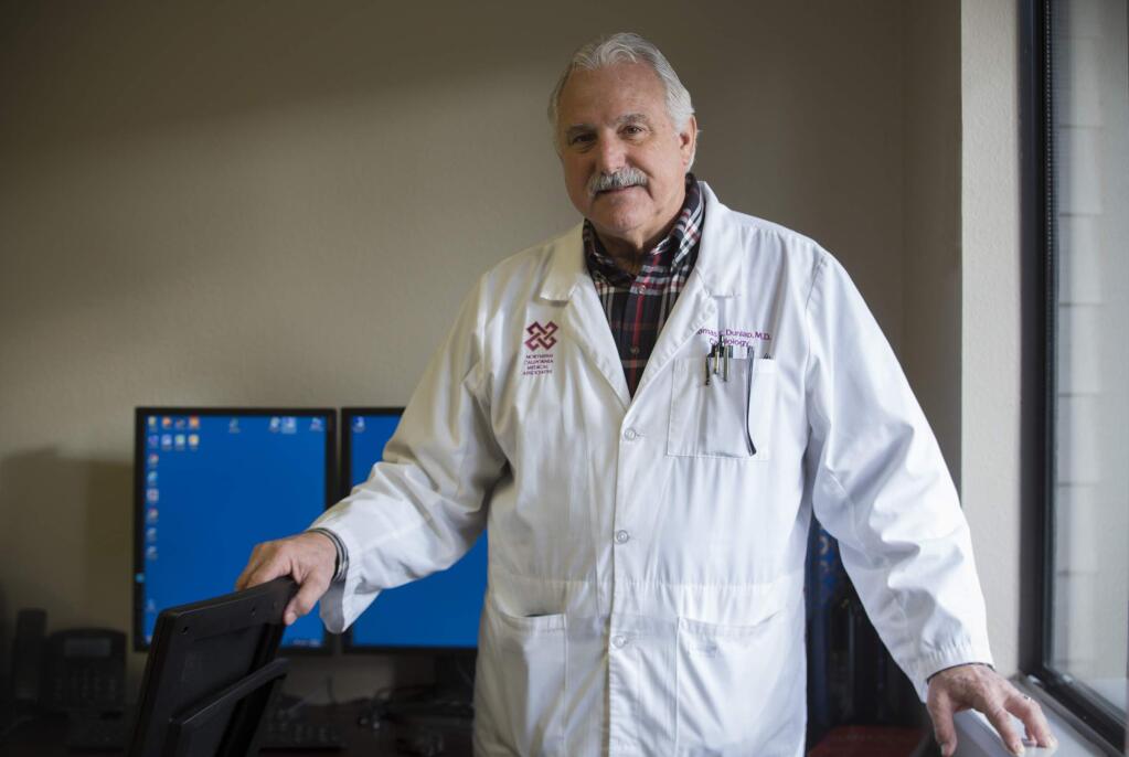Dr. Tom Dunlap in his office on Third St. West. (Photo by Robbi Pengelly/Index-Tribune)