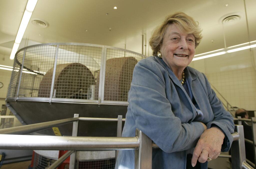 File - In this Oct. 6, 2006, file photo, Nan Tucker McEvoy stands inside the frantoio at the McEvoy Ranch in Petaluma, Calif. McEvoy, the last de Young heir to chair the San Francisco Chronicle, and a prominent olive oil rancher, died Thursday, March 26, 2015, after a long convalescence. She was 95. (AP Photo/Eric Risberg, File)