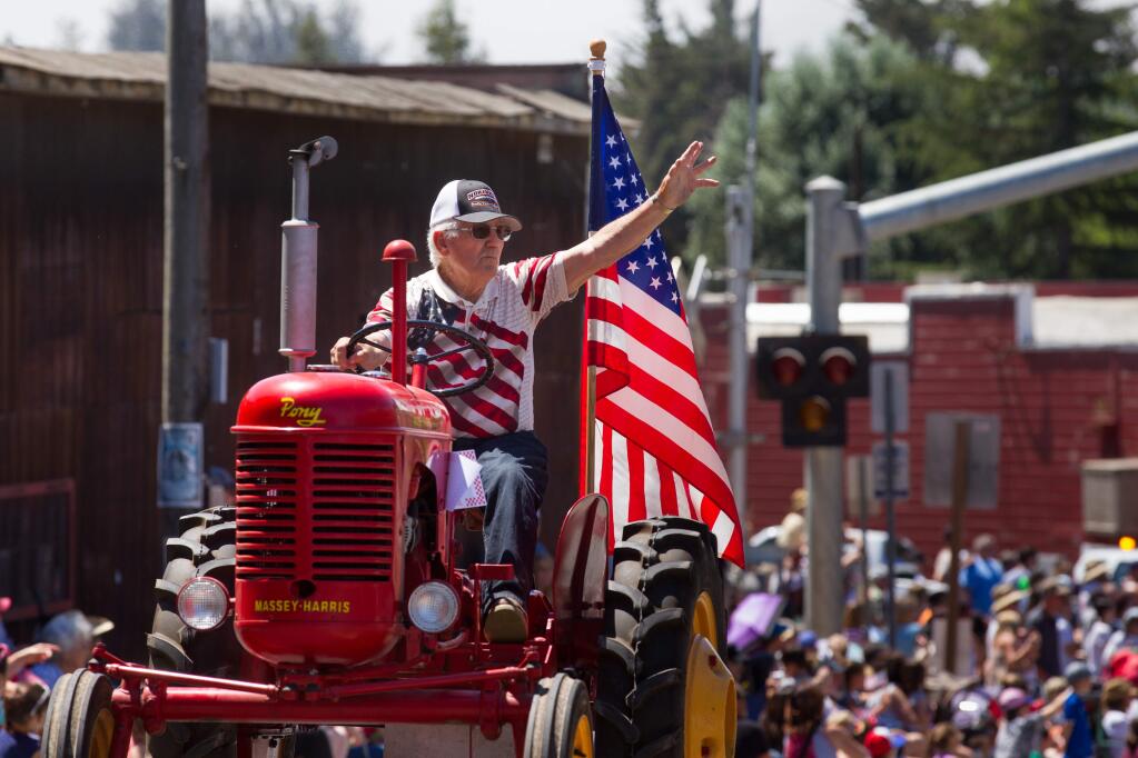 Al Vanderford, 82, of Penngrove, rides a vintage Massey Harris tractor at the 42nd Annual Penngrove Parade in Penngrove, on Sunday, July 1, 2018. (Darryl Bush / For The Press Democrat)