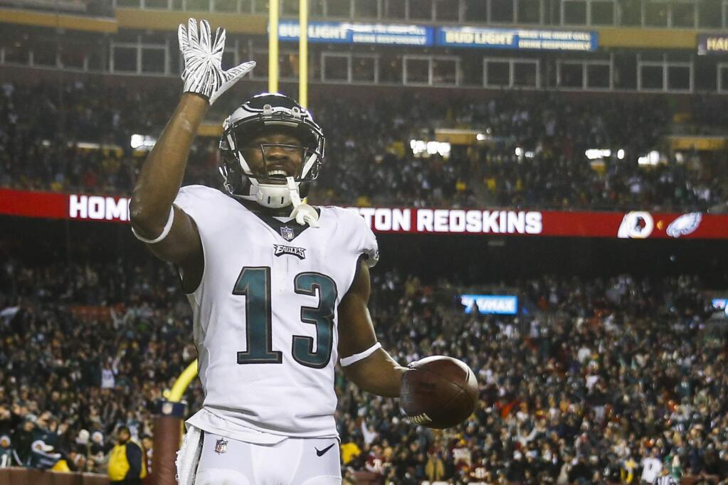 Philadelphia Eagles wide receiver Nelson Agholor (13) waves to the crowd after his touchdown during the second half of the NFL football game against the Washington Redskins, Sunday, Dec. 30, 2018 in Landover, Md. (AP Photo/Andrew Harnik)
