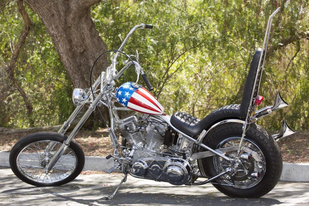 FILE - In this Sept. 4, 2014 file photo, a vintage 'Easy Rider' Captain America motorcycle is shown at Profiles in History auction house in Calabasas, Calif. Officials say a motorcycle reportedly featured in 'Easy Rider' sold for $1.35 million Saturday night Oct. 18, 2014.(AP Photo/Damian Dovarganes, File)
