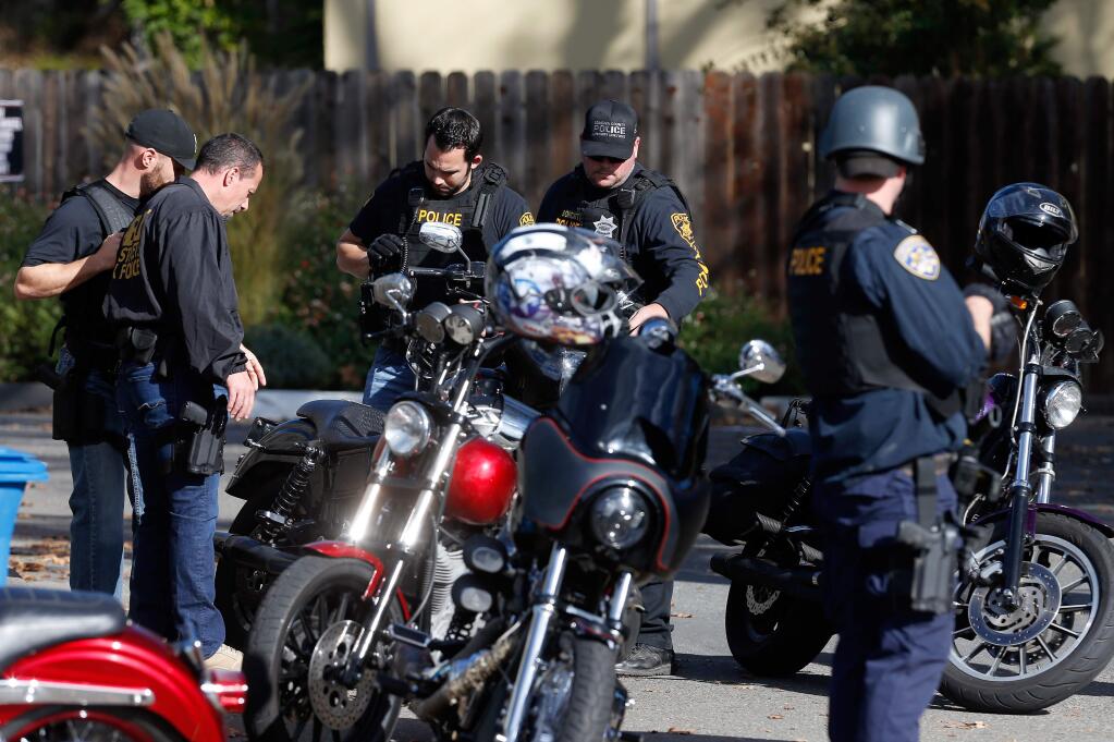 In this 2017 file photo, FBI agents, CHP officers and local law enforcement officers investigate the area around a bar on Mendocino Avenue in Santa Rosa after members of the Hells Angels were arrested there. (Alvin Jornada / The Press Democrat)