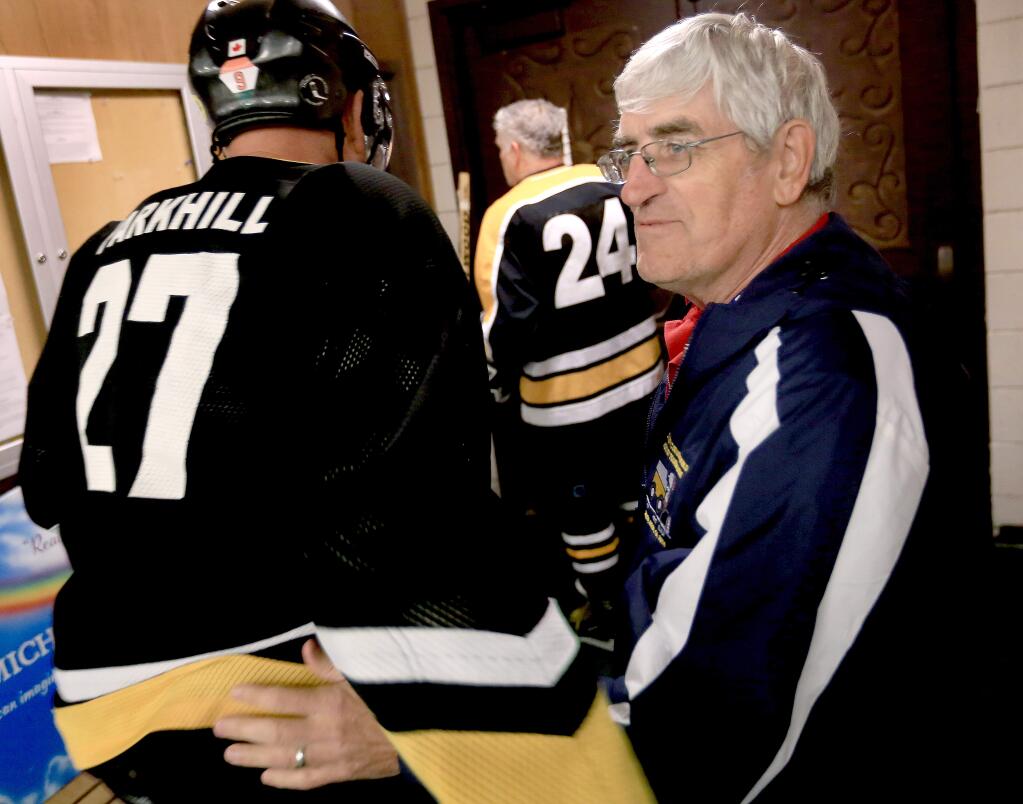 Norm Beaudin greets Jim Parkhill after a morning game. Beaudin is the coach of the Reno Aces as his team competes in the 39th Annual Snoopy's Senior World Hockey Tournament in Santa Rosa. (Kent Porter / Press Democrat)