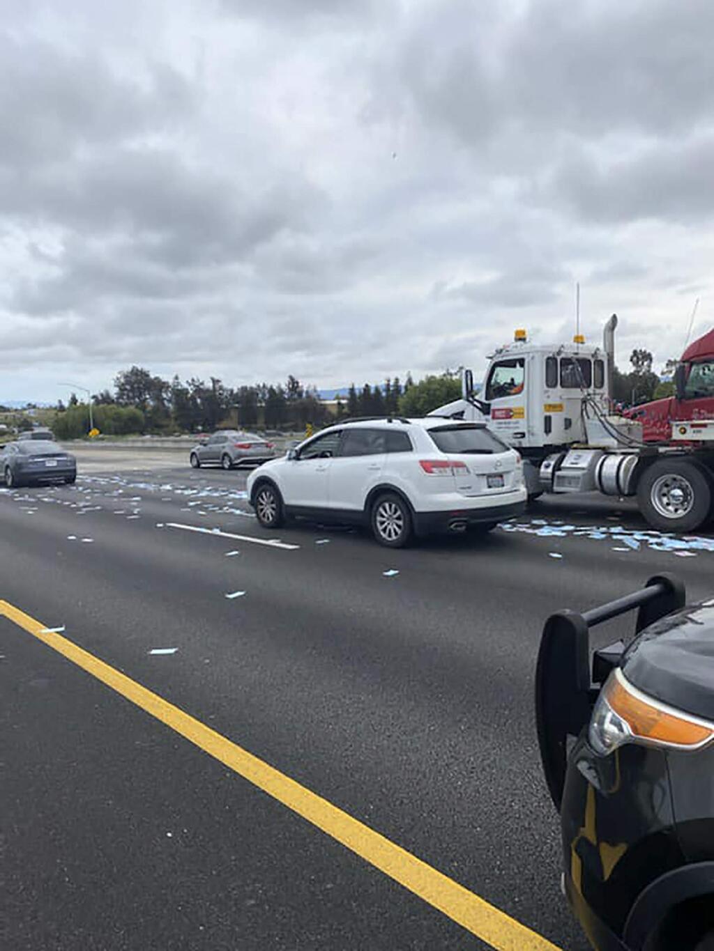 This photo provided by the California Highway Patrol Hayward shows spilled masks on Interstate 880 near Whipple Road in Union City, Calif., on April 29, 2020. The California Highway Patrol says someone who tossed hundreds of medical masks onto the freeway sparked a mini-traffic jam in the San Francisco Bay Area. (Hayward CHP via AP)