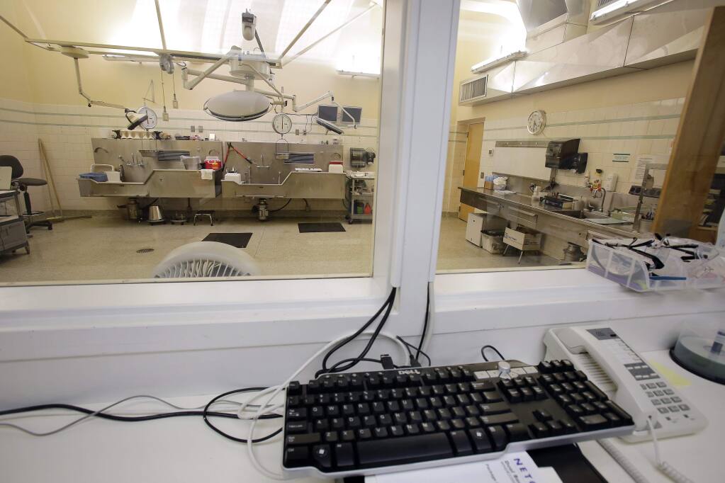Cameras installed above the lights over the Sonoma County Coroner's operating theater allow detectives and investigators to watch autopsies in the next room in Santa Rosa. (PD FILE, 2014)