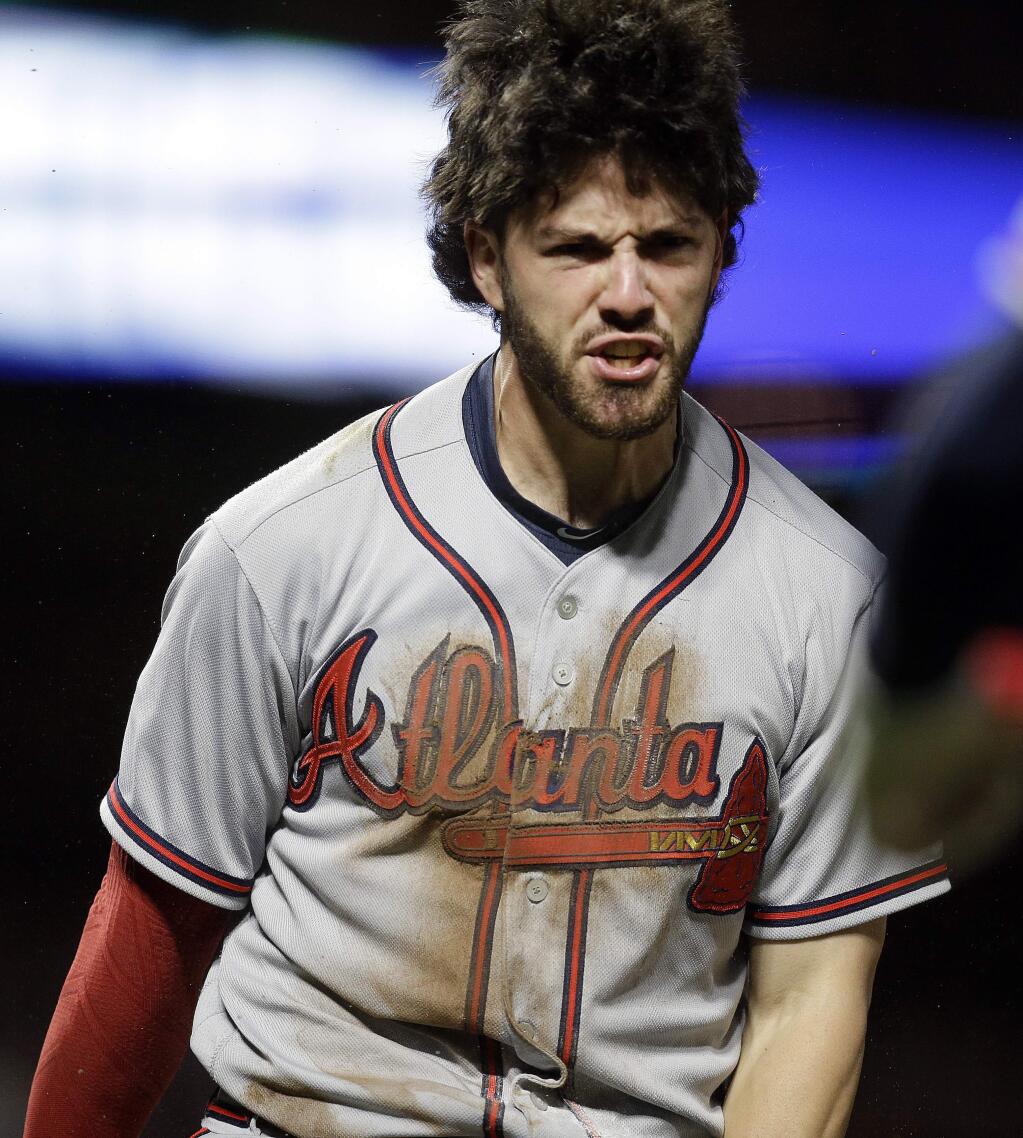Atlanta Braves Dansby Swanson celebrates after scoring against the San Francisco Giants in the seventh inning of a baseball game Friday, May 26, 2017, in San Francisco. Swanson scored on a single by pitcher Jaime Garcia. (AP Photo/Ben Margot)