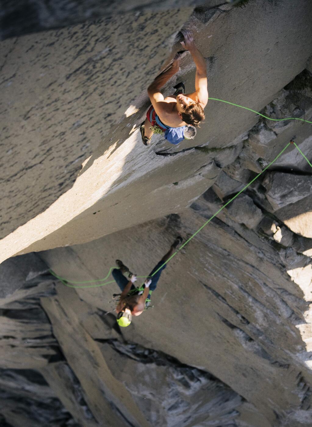 In this June 3, 2018 photo provided by Corey Rich, Alex Honnold, top and Tommy Caldwell climb The Nose of El Capitan in Yosemite National Park, Calif. Days after two of the world's most celebrated rock climbers twice set astonishingly fast records on the biggest wall in Yosemite National Park, they did it again Wednesday, June 6, 2018, breaking a mark compared with track's four-minute mile. (Corey Rich/Reel Rock/Novus Select via AP)