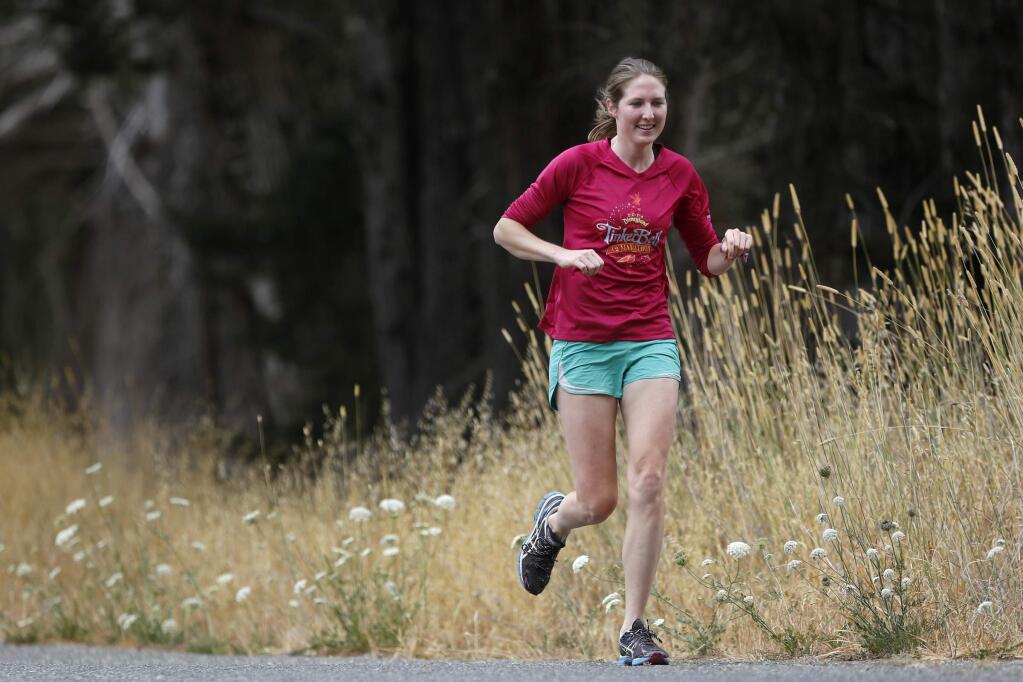 In preparation for the full Vineman triathlon, Caitlin Scheder-Bieschin goes for a morning run near her home in Cotati, on Wednesday, July 23, 2014. (BETH SCHLANKER/ The Press Democrat)
