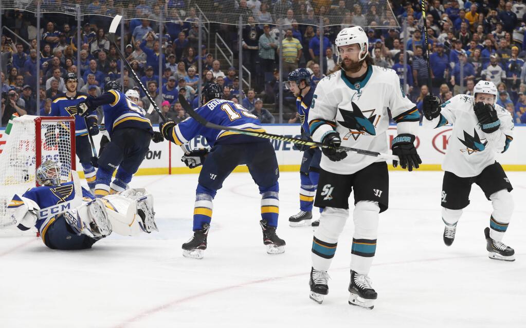 San Jose Sharks defenseman Erik Karlsson skates away after scoring the winning goal past St. Louis Blues goaltender Jordan Binnington, left, during overtime in Game 3 of the NHL Western Conference final series Wednesday, May 15, 2019, in St. Louis. The Sharks won 5-4 to take a 2-1 lead in the series. (AP Photo/Jeff Roberson)