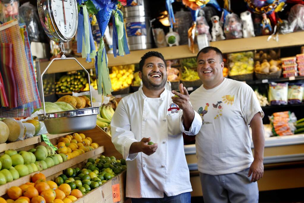Brothers Pedro, left, and Octavio Diaz at their store Casa del Mole Mercado and Carniceria in Healdsburg, on Monday, August 10, 2015. The brothers also own three Mexican restaurants in Sonoma County.(BETH SCHLANKER/ The Press Democrat)