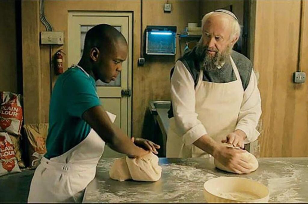 Docler EntertainmentAn old Jewish baker (Jonathan Pryce) sees his struggling business boom when his young apprentice (Jerome Holder) accidentally drops marijuana into the dough in 'Dough.'