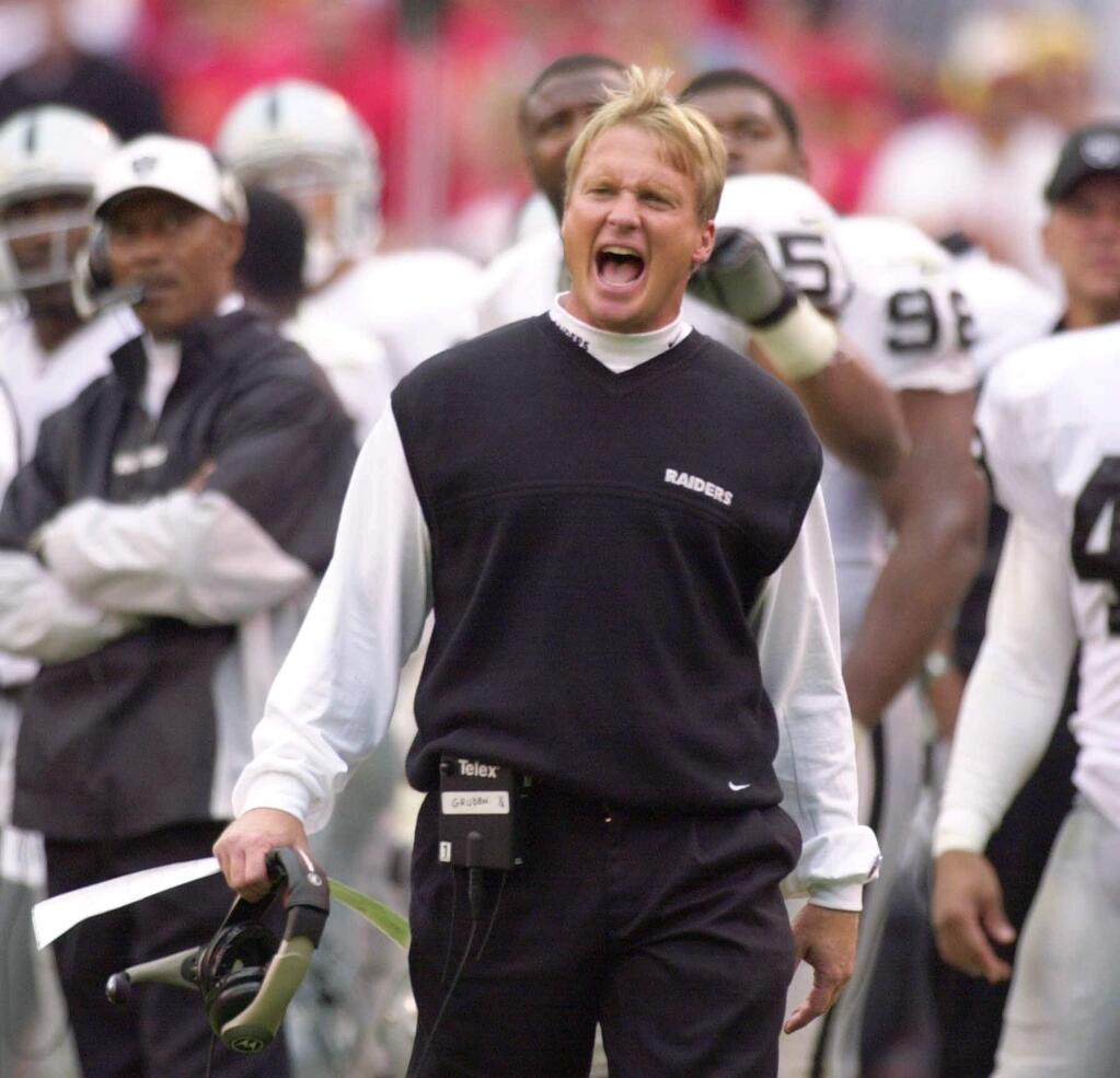 Oakland Raiders coach Jon Gruden yells to his team while officials review a play in the second half against the Kansas City Chiefs in Kansas City, Mo., Sunday, Oct, 15, 2000. (AP Photo/Jim Barcus)