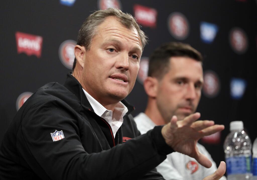 San Francisco 49ers general manager John Lynch, left, and head coach Kyle Shanahan field questions during the team's training camp Thursday, July 27, 2017, in Santa Clara. (AP Photo/Marcio Jose Sanchez)