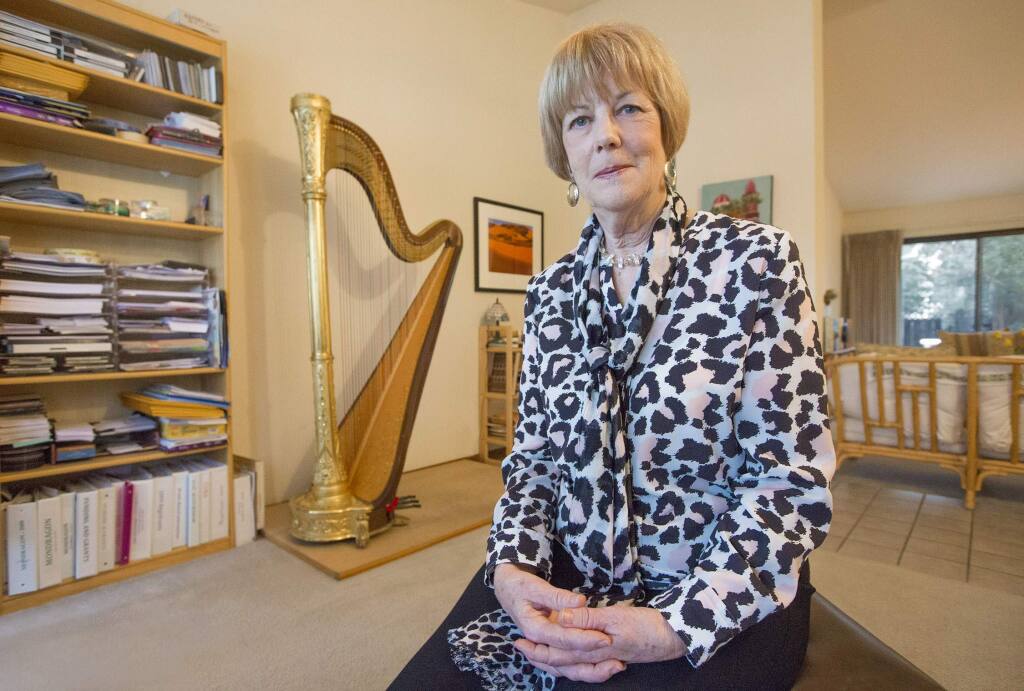 A plucky spirit: Georgia Kelly rode her harp to New Age notoriety in the 1970s; today she finds peace in Praxis. (Photo by Robbi Pengelly/Index-Tribune)