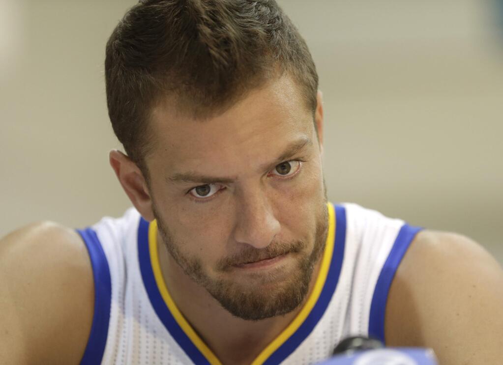 Golden State Warriors' David Lee answers questions from reporters during NBA basketball media day, Monday, Sept. 29, 2014, in Oakland, Calif. (AP Photo/Ben Margot)