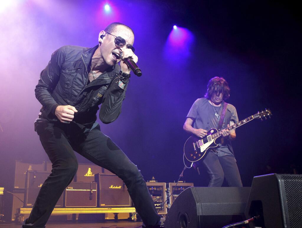 FILE - In this May 16, 2015, file photo, Chester Bennington performs in concert during the MMRBQ Music Festival 2015 at the Susquehanna Bank Center in Camden, N.J. Bennington's band Linkin Park released an episode of 'Carpool Karaoke' on Oct. 12, 2017, that was taped in July, six days before Bennington took his own life on July 20. (Photo by Owen Sweeney/Invision/AP, File)