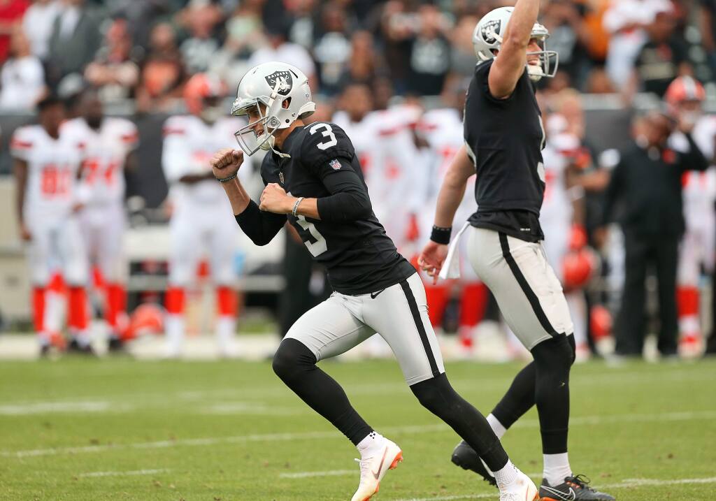 Oakland Raiders kicker Matt McCrane celebrates hitting teh field goal to defeat the Cleveland Browns in overtime, during their game in Oakland on Sunday, September 30, 2018. Raiders beat the Browns.(Christopher Chung/ The Press Democrat)