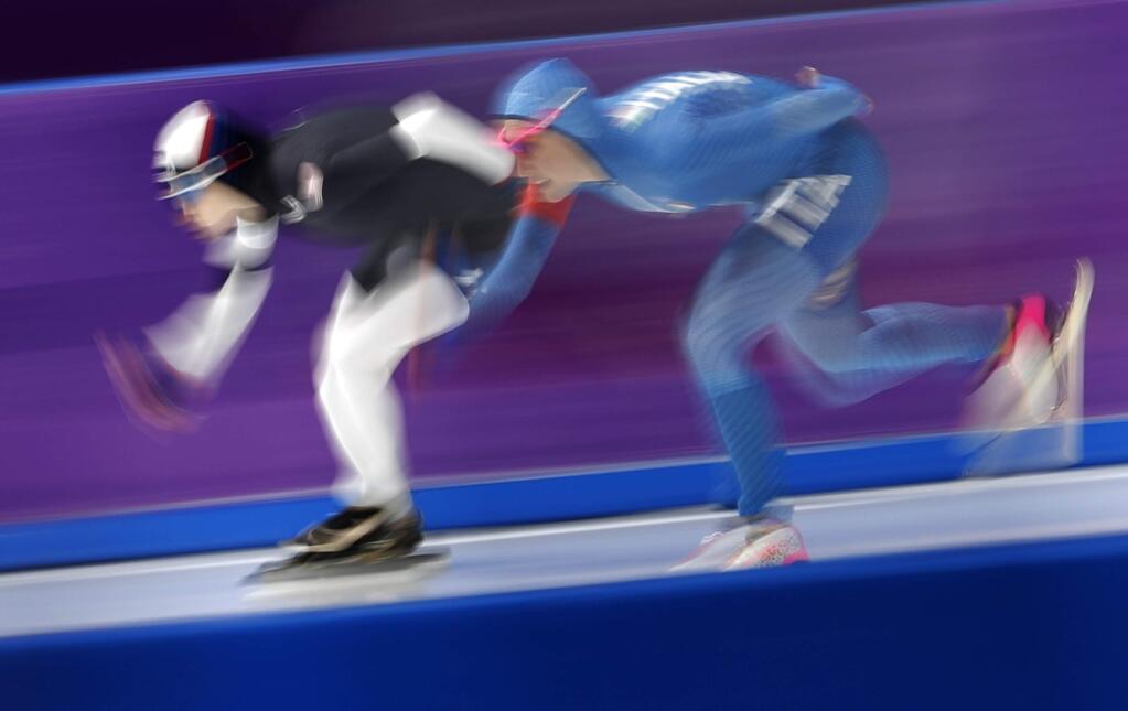 Mia Manganello of the United States, left, and Francesca Lollobrigida of Italy, right, compete during the women's 1,500 meters speedskating race at the Gangneung Oval at the 2018 Winter Olympics in Gangneung, South Korea, Monday, Feb. 12, 2018. (AP Photo/Petr David Josek)