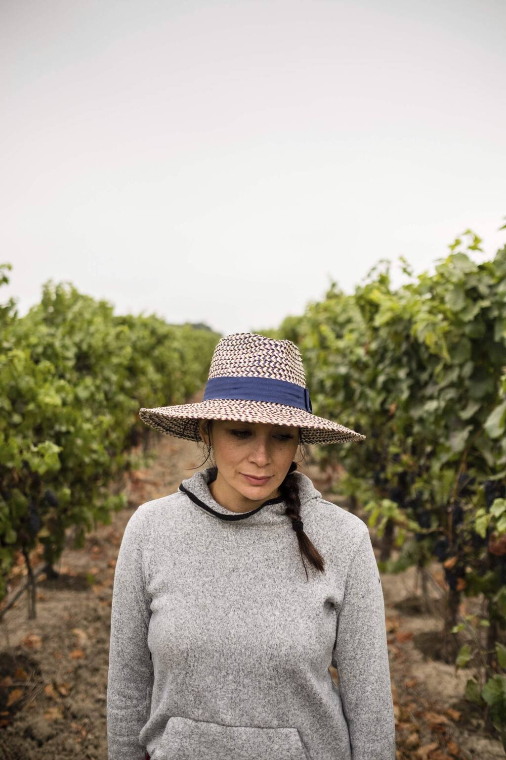 In this Aug. 24, 2017, photo provided by Quiet Pictures, Vanessa Robledo, a Mexican American grape grower and entrepreneur, walks through one her mother's three vineyards in Napa. 'Harvest Season,' a new PBS documentary, examines the contributions of Mexican Americans in the wine industry of California's Napa Valley. (Roberto 'Bear' Guerra/Quiet Pictures via AP)
