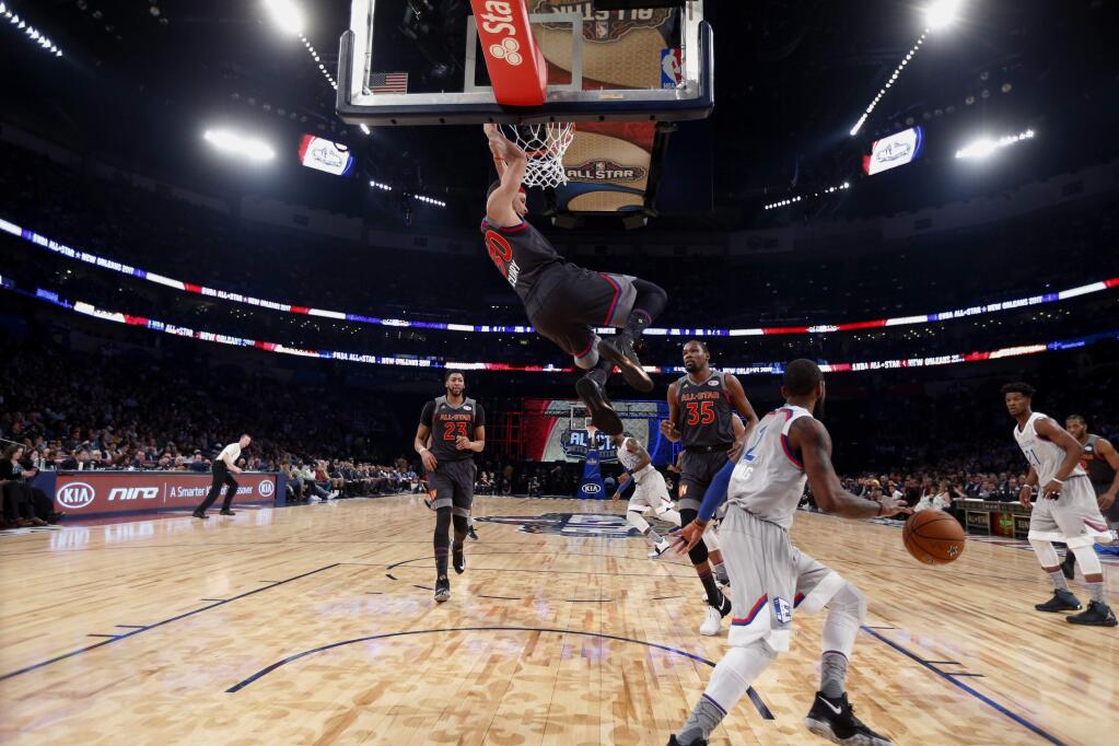Western Conference guard Stephen Curry of the Golden State Warriors (30) slam dunks during the first half of the NBA All-Star basketball game in New Orleans, Sunday, Feb. 19, 2017. (AP Photo/Gerald Herbert, Pool)