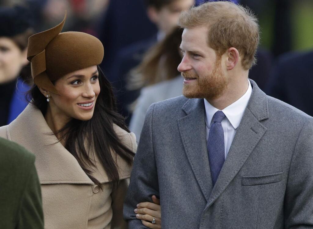 FILE - This is a Monday, Dec. 25, 2017. file photo of Britain'sPrince Harry and his fiancee Meghan Markle as they arrive to attend the traditional Christmas Day service, at St. Mary Magdalene Church in Sandringham, England. A political storm is brewing ahead of Prince Harry's and Meghan Markle's May 19 wedding over whether to crack down on homeless people and beggars in the well-to-do English town of Windsor. (AP Photo/Alastair Grant/File)