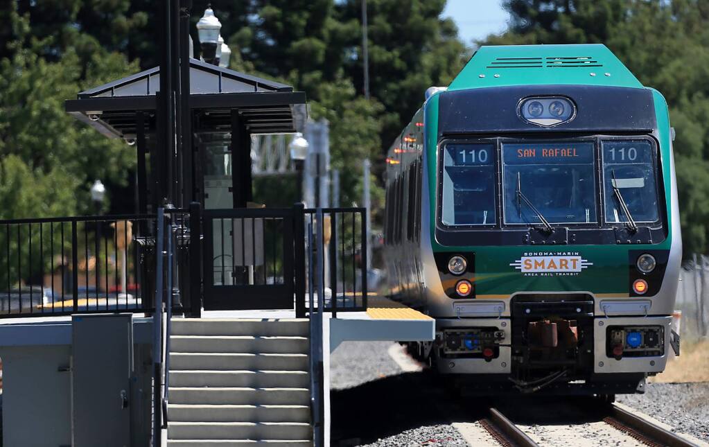 A SMART train heads for San Rafael after stopping at the Railroad Square station in Santa Rosa in June 2017. (Kent Porter/ The Press Democrat)