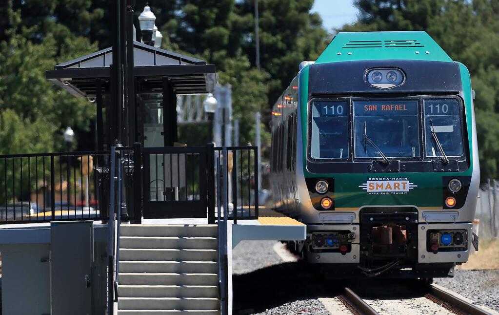A SMART train heads for San Rafael after stopping at the Railroad Square station in Santa Rosa in June. (KENT PORTER/ PD FILE, 2017)